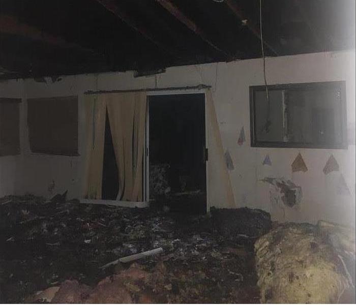 San Diego home's fire causes extreme damage to the roof, insulation, and walls of living room or family room.