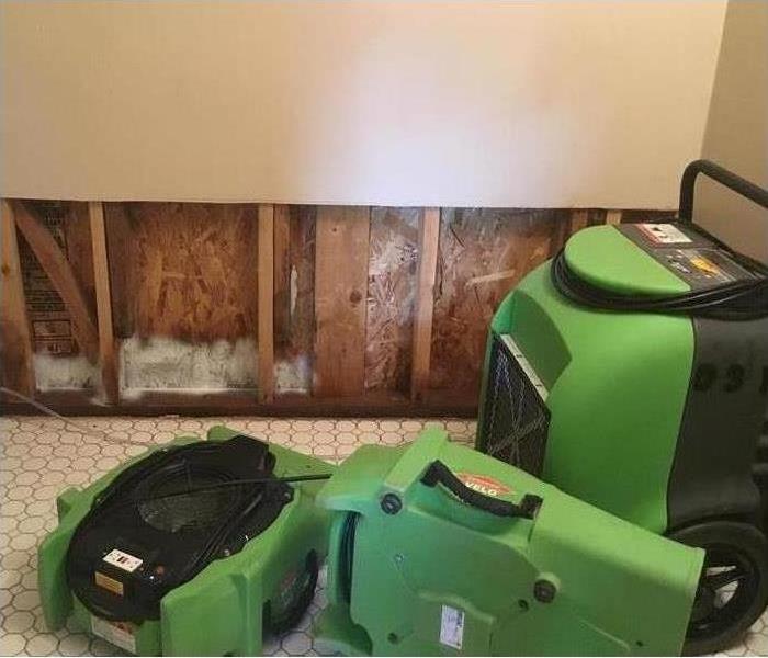 Flooding in San Diego home leads to water damage. SERVPRO of Santee/Lakeside technicians install fans to dry area